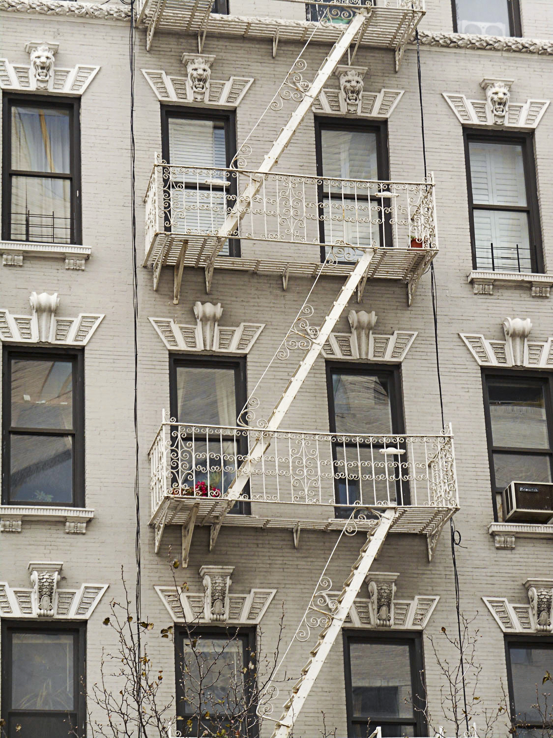 Decorative fire escape steps on a building in NYC