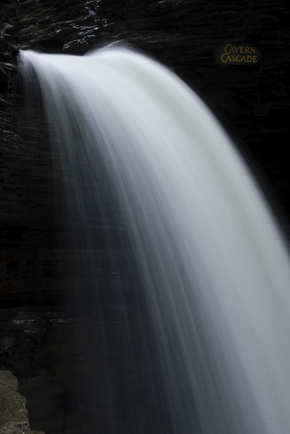 A thin waterfall spraying off rocks