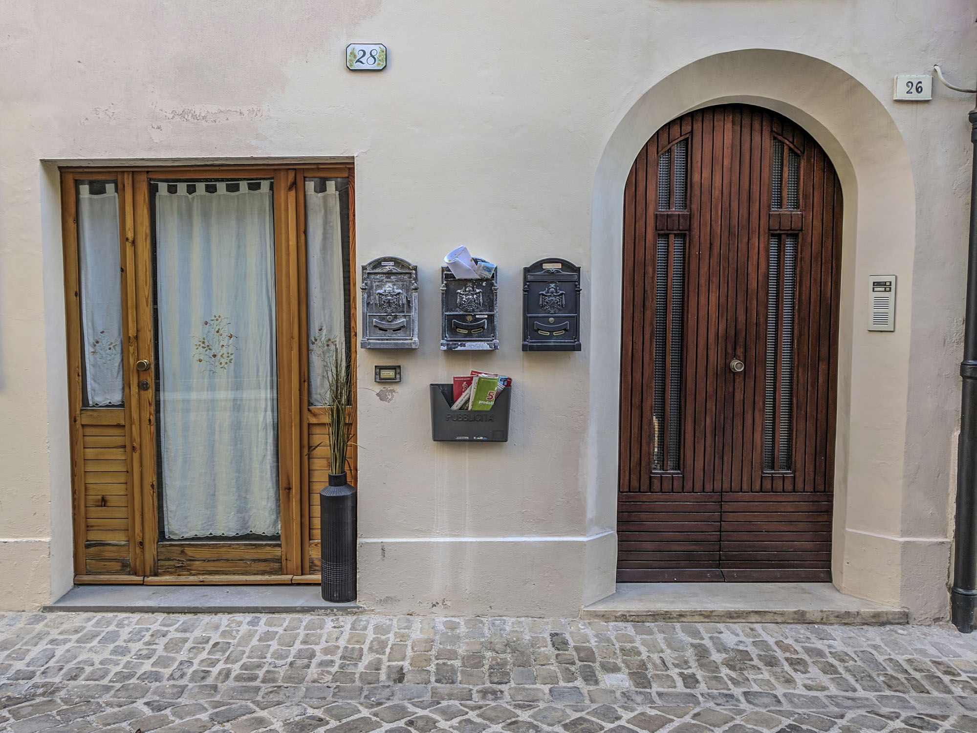 Two doors in Italy with different shapes