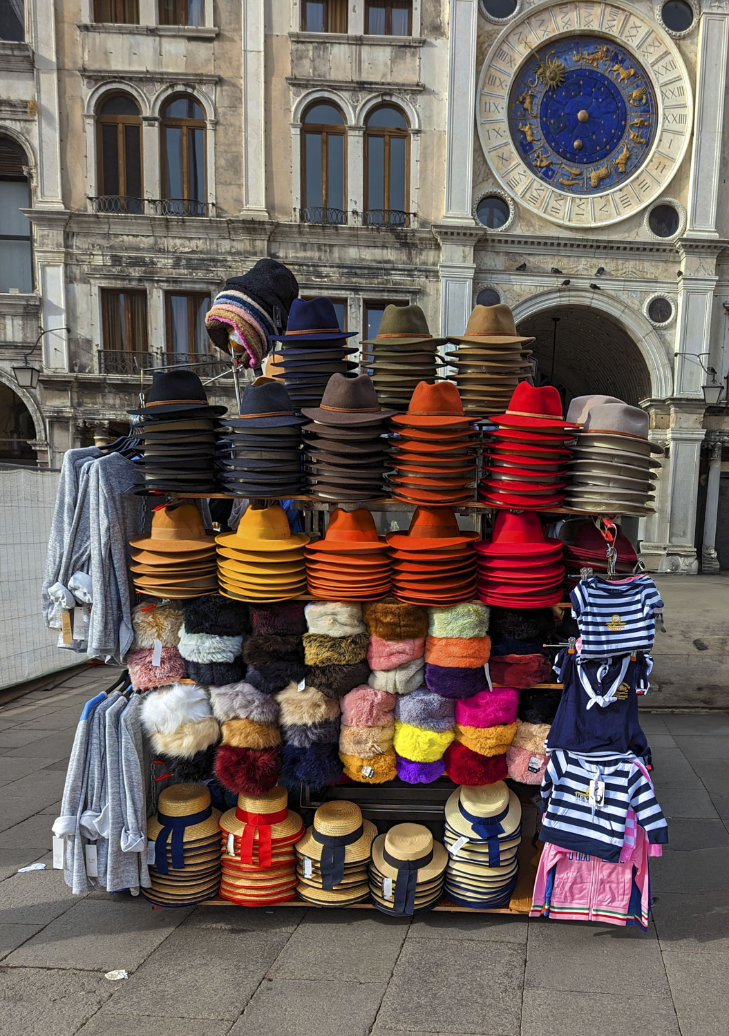 A vendor stand in Venice with hats of many colors
