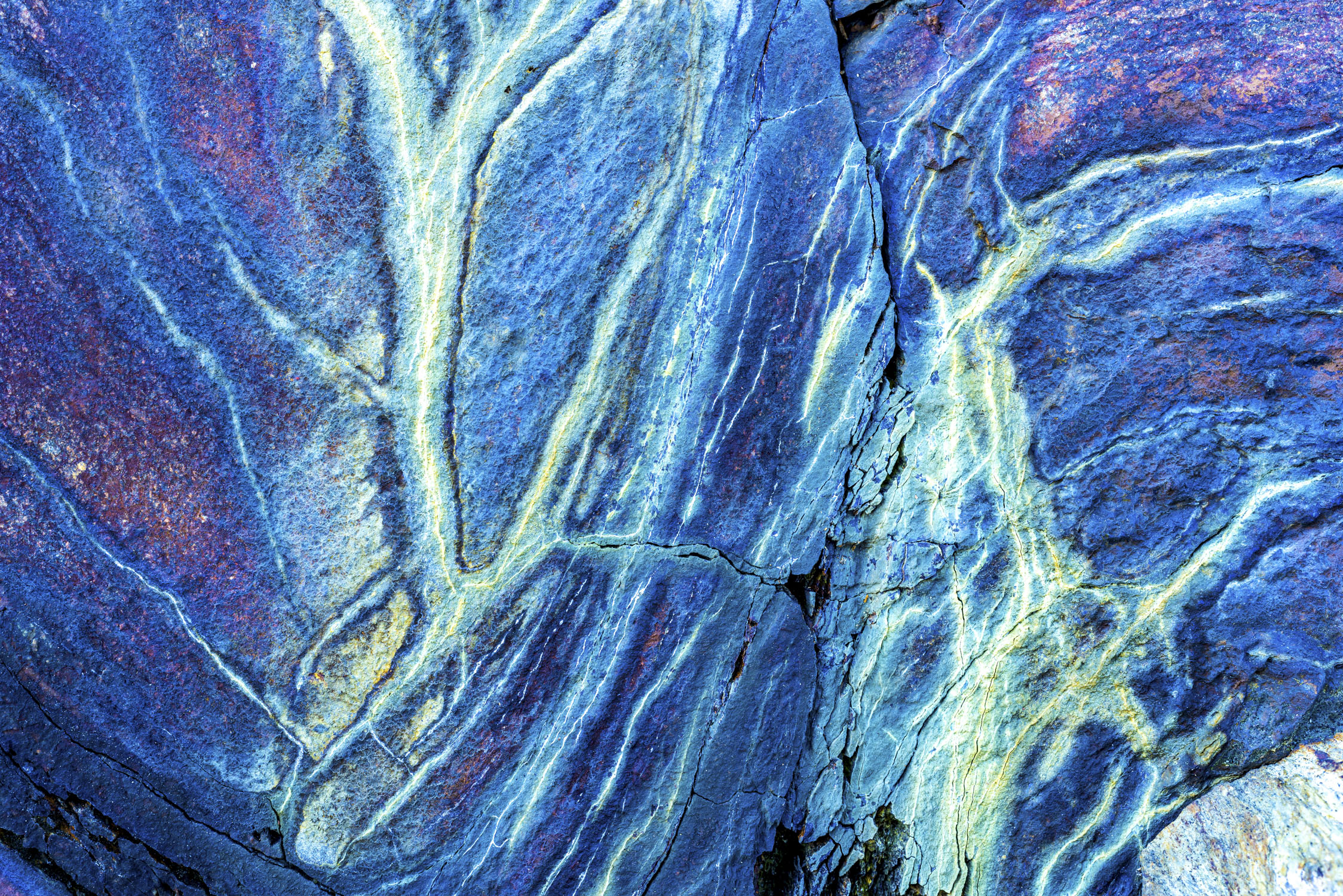 Stone with many colored veins through it