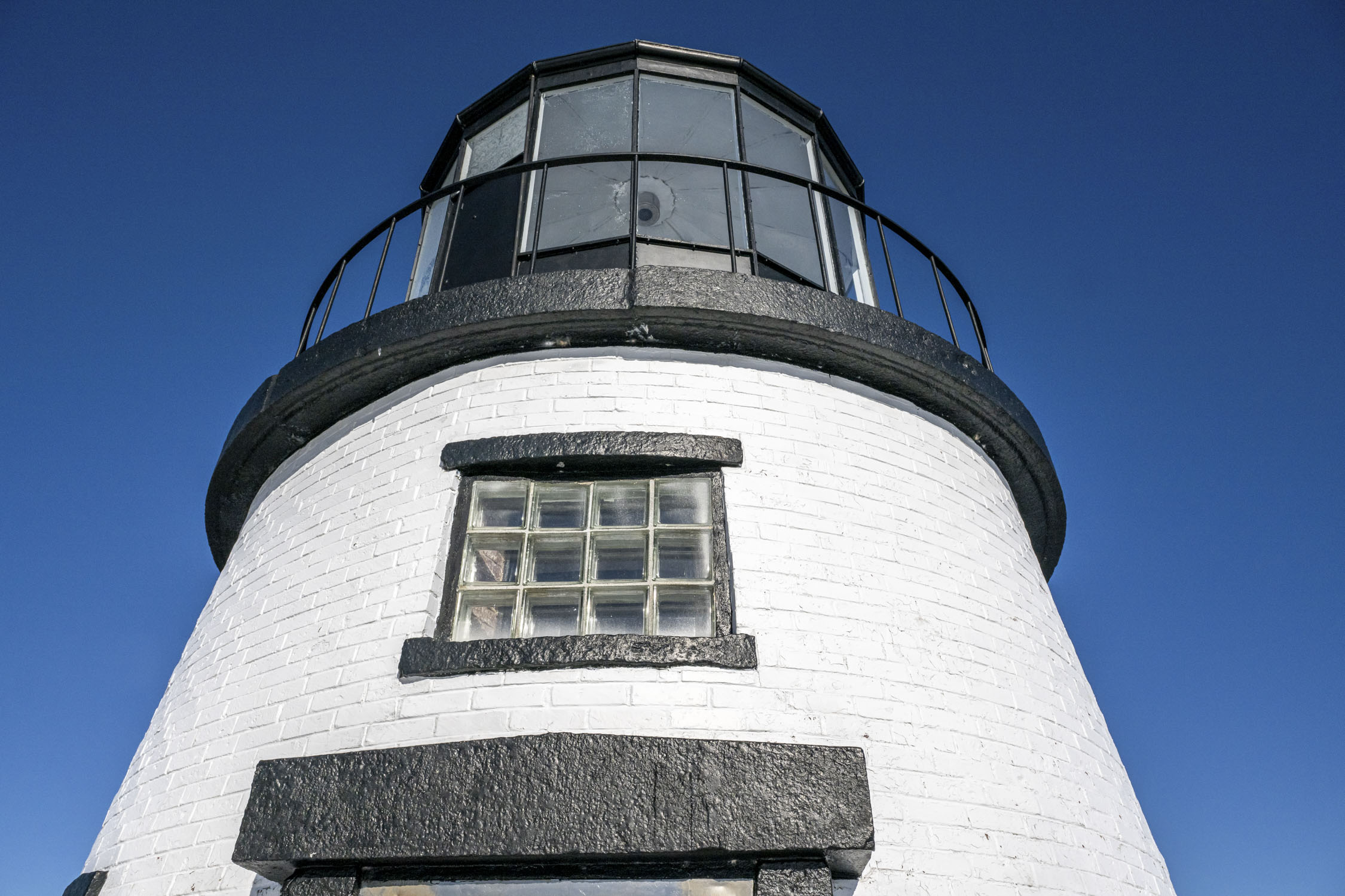 Looking up at the top section of a lighthouse