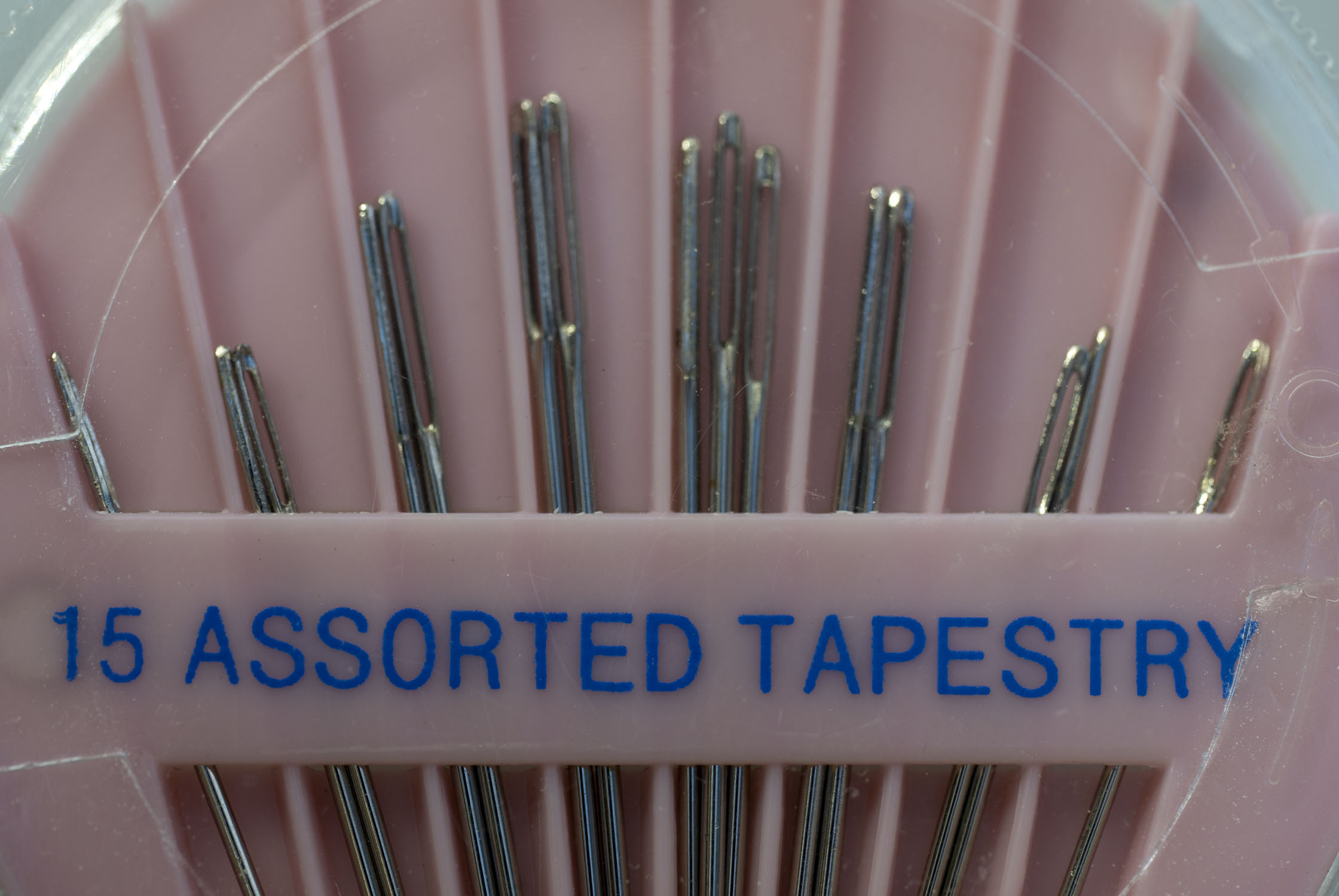 A pink package of assorted tapestry needles 