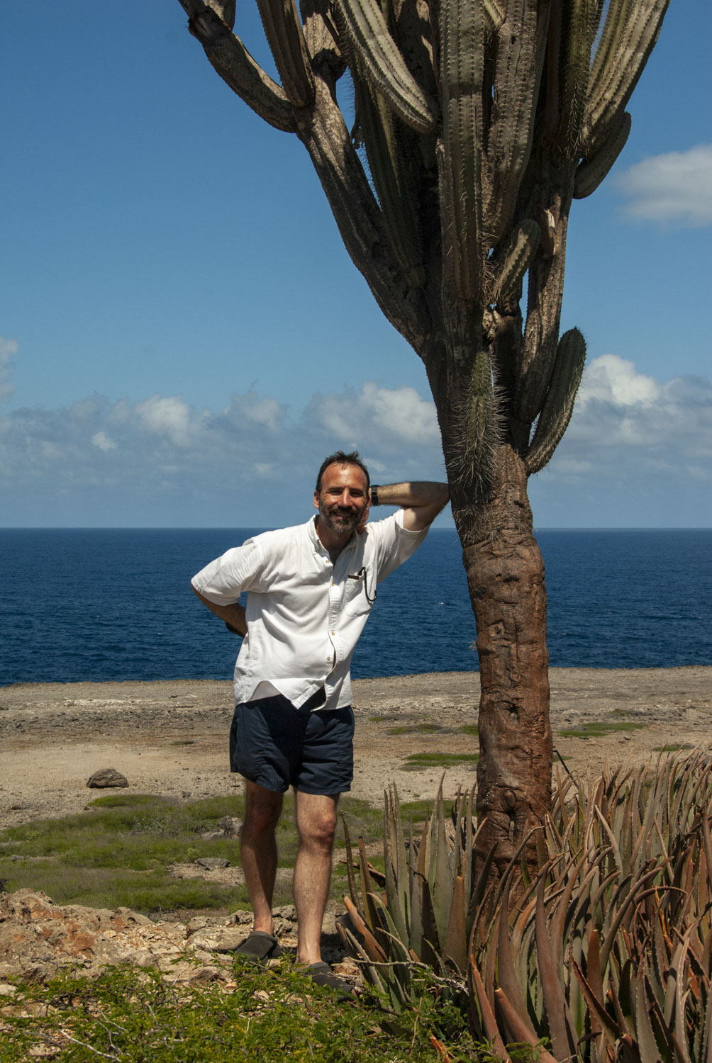 Paul leaning against a cactus