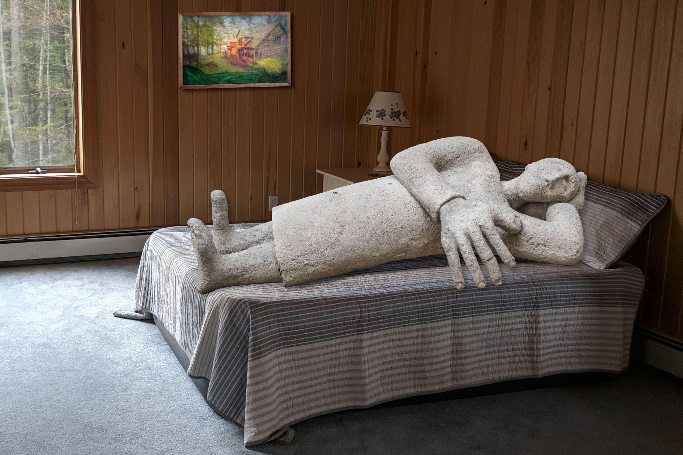 A stone sculpture of a sleeping man put into a picture of a bed at Sebago