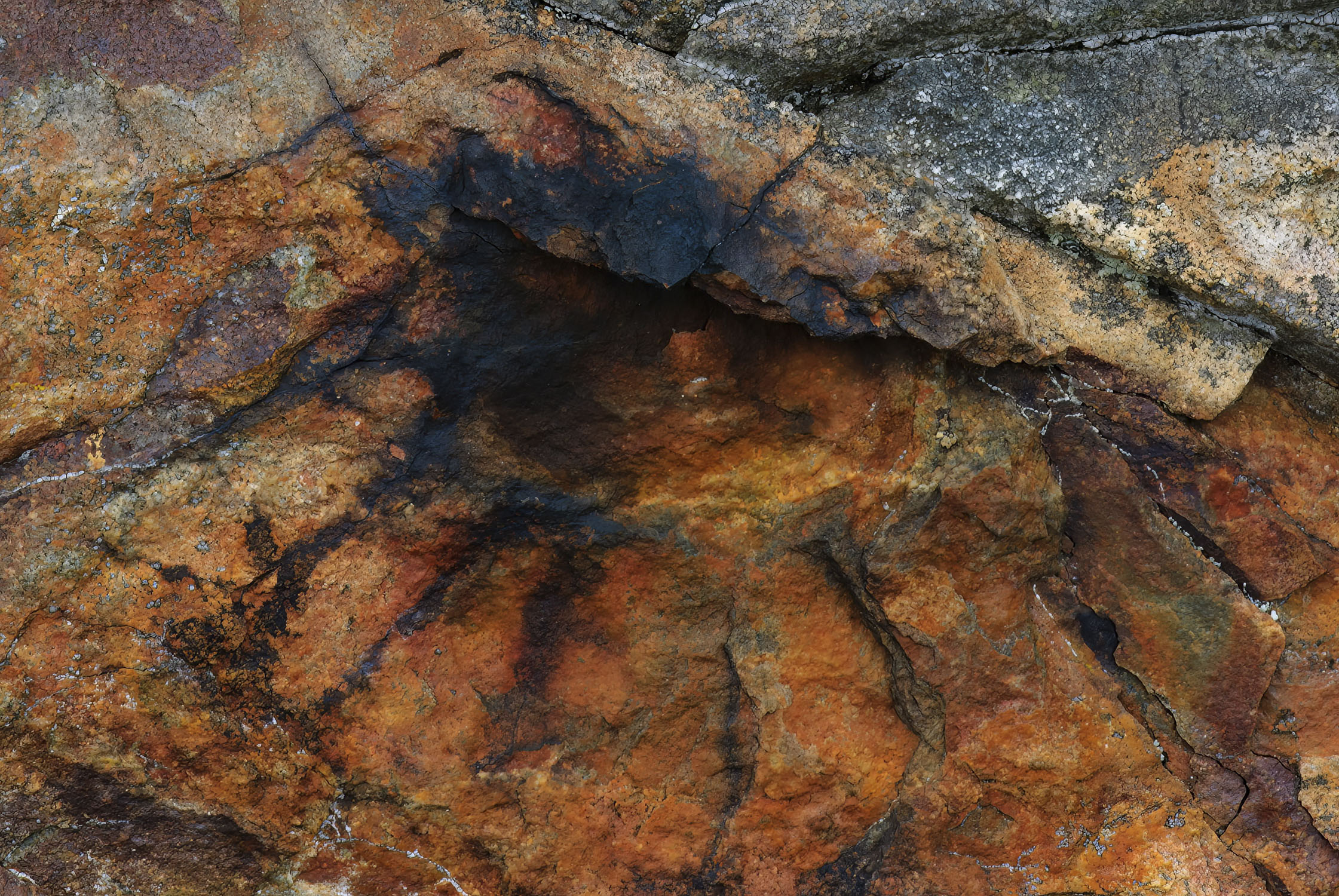 Rock with colors and shape that looks like an eye and eyelashes