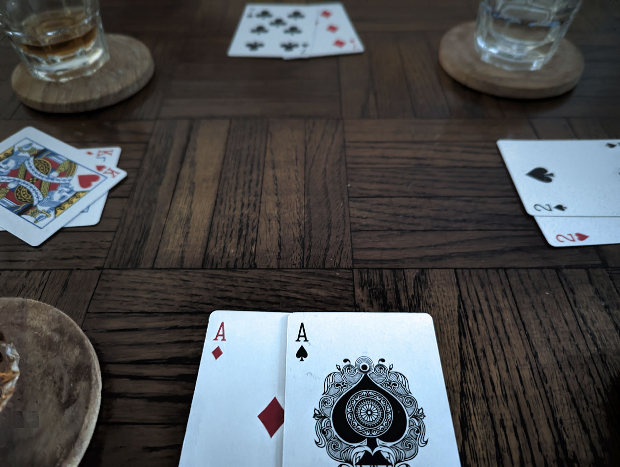 Pairs of cards on a table with drinks